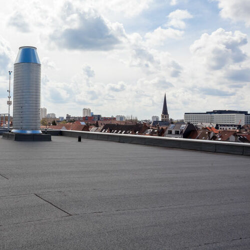 Chimney on the flat roof in a city